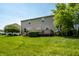 Charming two-story home featuring a deck, a spacious lawn, and tasteful landscaping at 2209 S Logan Dr, New Palestine, IN 46163