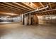 Unfinished basement with concrete floor, exposed ceiling, and utilities at 2209 S Logan Dr, New Palestine, IN 46163