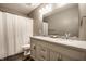 Bathroom features double vanity, modern fixtures, and a shower with white curtain at 2209 S Logan Dr, New Palestine, IN 46163