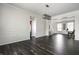 Spacious entryway showcasing trim detail, wood floors, and open floor plan at 2209 S Logan Dr, New Palestine, IN 46163