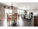 Bright and airy living space featuring hardwood floors, fireplace, and dining area at 2209 S Logan Dr, New Palestine, IN 46163