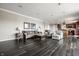 Open concept living area showing wood flooring, fireplace and seating at 2209 S Logan Dr, New Palestine, IN 46163