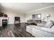Comfortable living room with fireplace, wood floors, and neutral decor at 2209 S Logan Dr, New Palestine, IN 46163