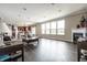 Open-concept living area with fireplace, and expansive windows for natural light at 2209 S Logan Dr, New Palestine, IN 46163