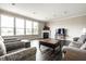Spacious living room featuring fireplace, large windows, and comfortable seating at 2209 S Logan Dr, New Palestine, IN 46163