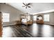 A spacious main bedroom features high ceilings and wood floors, creating an open and airy atmosphere at 2209 S Logan Dr, New Palestine, IN 46163