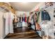 Spacious walk-in closet with ample storage and stylish dark wood floors at 2209 S Logan Dr, New Palestine, IN 46163