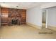 Spacious finished basement with a brick fireplace and built-in bookshelves at 2414 Constellation Dr, Indianapolis, IN 46229