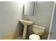 Bathroom featuring a pedestal sink, toilet, and neutral decor at 2414 Constellation Dr, Indianapolis, IN 46229