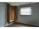 Built-in closet in this bedroom with wood-look floors and neutral paint at 2414 Constellation Dr, Indianapolis, IN 46229