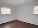 This bedroom features wood-look floors and dual windows at 2414 Constellation Dr, Indianapolis, IN 46229