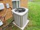 Exterior view of an air conditioning unit sitting on a concrete slab, showcasing the home's cooling system at 2414 Constellation Dr, Indianapolis, IN 46229