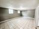 Spacious basement with tile floors, block walls, and windows at 2419 Tamarack Pl, Anderson, IN 46011