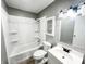 Bathroom with white fixtures including a tub and shower combo with a single sink at 2419 Tamarack Pl, Anderson, IN 46011