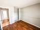 Bedroom with hardwood floors, grey walls, and natural light at 2419 Tamarack Pl, Anderson, IN 46011