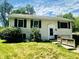 Charming two-story home with black shutters and well-maintained landscaping at 2419 Tamarack Pl, Anderson, IN 46011