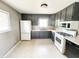 Well-lit kitchen featuring modern appliances and gray cabinetry at 2419 Tamarack Pl, Anderson, IN 46011