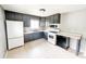 Functional kitchen featuring modern appliances and gray cabinets at 2419 Tamarack Pl, Anderson, IN 46011