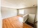 Inviting living room featuring wood floors and a bright window with natural light at 2419 Tamarack Pl, Anderson, IN 46011