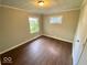 Cozy bedroom with refinished hardwood floors and natural light at 2624 E 17Th St, Indianapolis, IN 46218