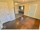 Open-concept living area with refinished hardwood floors and fresh paint at 2624 E 17Th St, Indianapolis, IN 46218