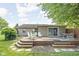 Inviting wooden deck with steps down to the yard features outdoor seating and dining areas at 3020 E 400 S, Lebanon, IN 46052