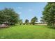 Expansive backyard featuring lush greenery and mature trees, perfect for recreation at 3020 E 400 S, Lebanon, IN 46052