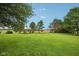 Expansive lawn dotted with trees, creating a serene and spacious backyard retreat at 3020 E 400 S, Lebanon, IN 46052