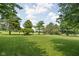 Expansive backyard with trees and a lush green lawn, great for outdoor activities at 3020 E 400 S, Lebanon, IN 46052