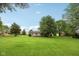 Large grassy backyard, enhanced by mature trees, offers a serene outdoor space at 3020 E 400 S, Lebanon, IN 46052