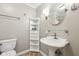 Charming bathroom featuring a pedestal sink and built-in shelving at 3020 E 400 S, Lebanon, IN 46052