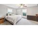 Cozy bedroom with gray carpet, white trim, and two windows with tree views at 3020 E 400 S, Lebanon, IN 46052
