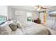 Comfortable bedroom boasts ceiling fan, sliding barn door, and neutral color palette at 3020 E 400 S, Lebanon, IN 46052