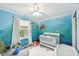 Whimsical bedroom with ocean-themed wall mural and plush white rug at 3020 E 400 S, Lebanon, IN 46052