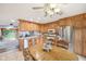 Eat-in kitchen featuring classic wood cabinetry, stainless steel appliances, and a bright dining area at 3020 E 400 S, Lebanon, IN 46052