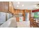 Bright kitchen with stainless steel refrigerator, tiled floor and wood cabinetry at 3020 E 400 S, Lebanon, IN 46052