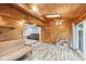 Spacious sunroom featuring wooden walls, wood ceiling, skylight, and vinyl flooring at 3020 E 400 S, Lebanon, IN 46052