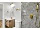 Bathroom features granite-look tiled shower with gold hardware plus a wood vanity at 3237 Thurston Dr, Indianapolis, IN 46224
