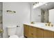 Modern bathroom with double vanity, gold fixtures, and tiled shower at 3237 Thurston Dr, Indianapolis, IN 46224
