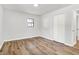 Bedroom features wood-look floors, closet, neutral paint and a window at 3237 Thurston Dr, Indianapolis, IN 46224