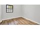 Bedroom features wood-look floors, neutral paint, and a window at 3237 Thurston Dr, Indianapolis, IN 46224