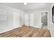 Bedroom with wood floors, closet, and view into an en-suite bathroom at 3237 Thurston Dr, Indianapolis, IN 46224