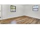 Bedroom with wood floors, two windows, and white walls at 3237 Thurston Dr, Indianapolis, IN 46224