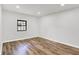 Bright bedroom with natural light, wood-look floors, and fresh paint at 3237 Thurston Dr, Indianapolis, IN 46224