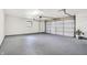 Garage shows neutral epoxy flooring, open ceiling with auto door at 3237 Thurston Dr, Indianapolis, IN 46224