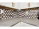 Detail of kitchen counter featuring granite countertops, stylish backsplash, and white cabinets at 3237 Thurston Dr, Indianapolis, IN 46224
