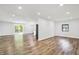 An open floor plan seamlessly blends living space with the kitchen and outdoor views at 3237 Thurston Dr, Indianapolis, IN 46224