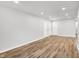Bright and airy living room with recessed lighting and wood-look flooring at 3237 Thurston Dr, Indianapolis, IN 46224