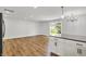Bright living room area with wood floors and sliding doors to the backyard at 3237 Thurston Dr, Indianapolis, IN 46224