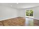 Sunny room with recessed lights, wood-look floors and a sliding glass door at 3237 Thurston Dr, Indianapolis, IN 46224